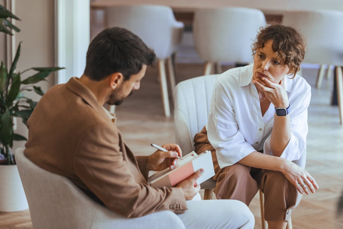 Counselor and client in a supportive therapy setting